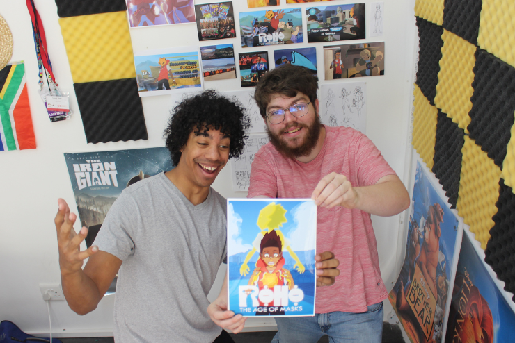 Roho the age of masks creators Christopher Cuningham and Connor Rhoda pose with their comic